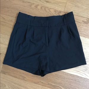 Black pleated shorts